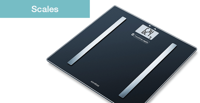 Digital scale showing 62.4 kg, with Sanitas and Healthcoach logos displayed.